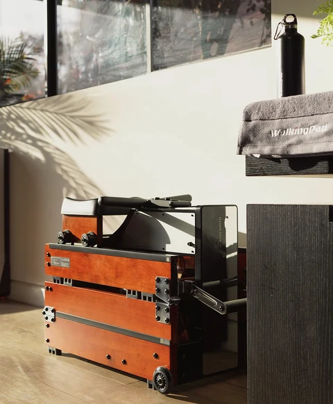 Movaped WM10 rowing machine stored neatly under furniture to save space